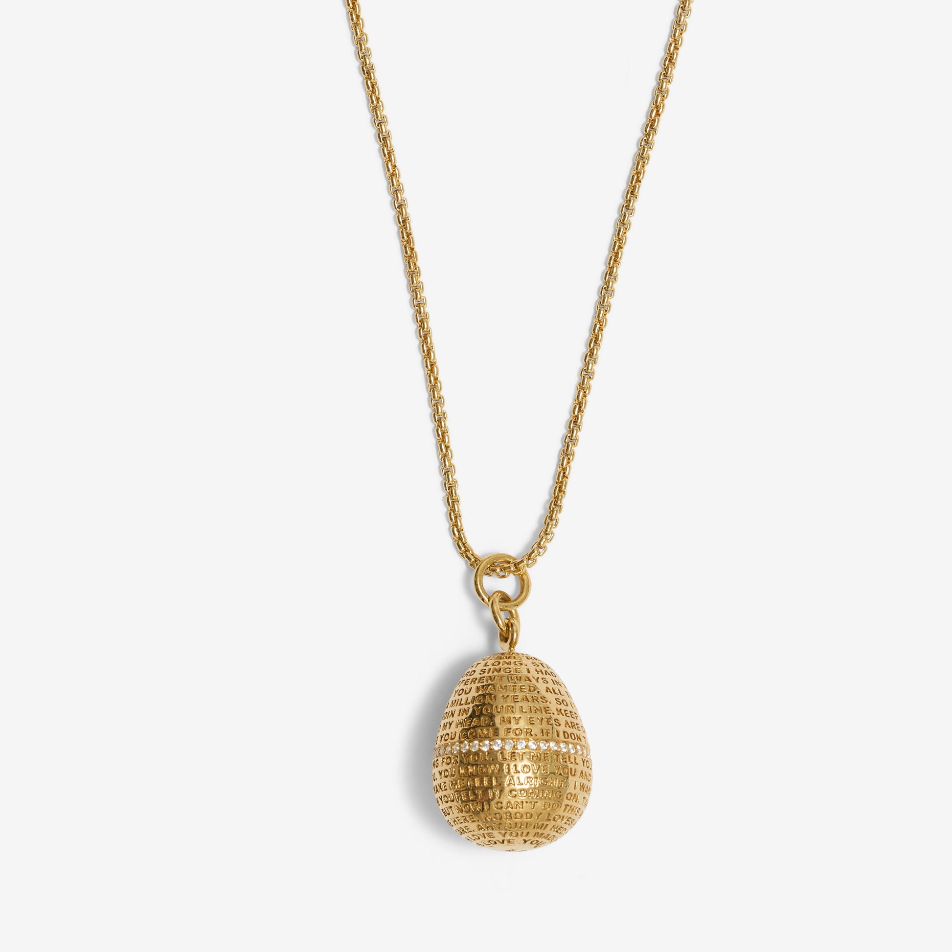 Gold necklace with a textured pendant on a white background