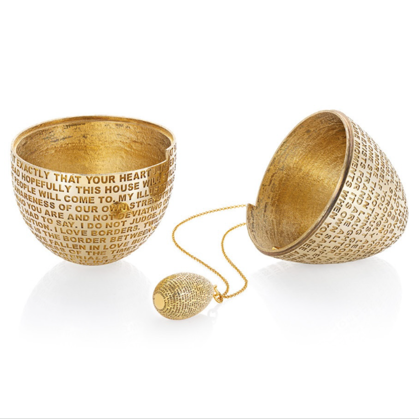 Gold textured bowl with intricate patterns on a white background